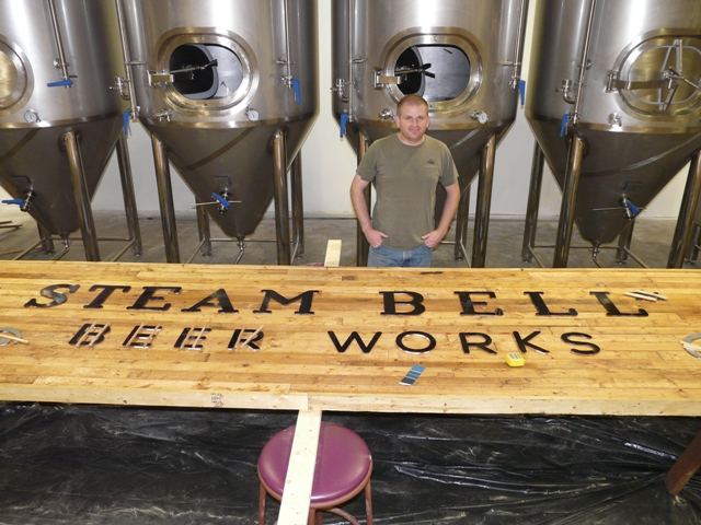 Steam Bell Beer Works Founder Brad Cooper with unfinished sign