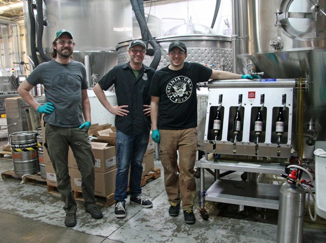 (L-R) Nick Anderson, Jasper Akerboom and Nassim Sultan bottle the Stublendious sour. The bottles are capped, labeled, and wax dipped by hand.